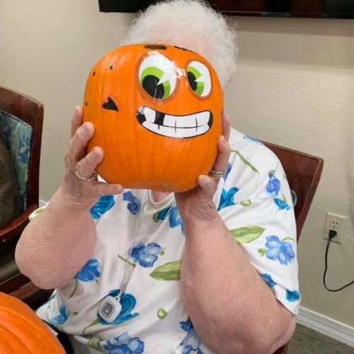 Resident holding pumpkin at Madison House in Norfolk, Nebraska