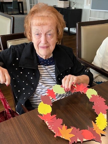 Arbour Square residents showed off their colorful leaf wreaths. 