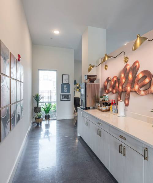 Pouring a glass of wine at Lofts at Houston Central in Warner Robins, Georgia