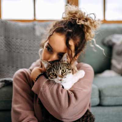 Woman holding a cat in a pet-friendly apartment at The Kensington in Charlotte, North Carolina