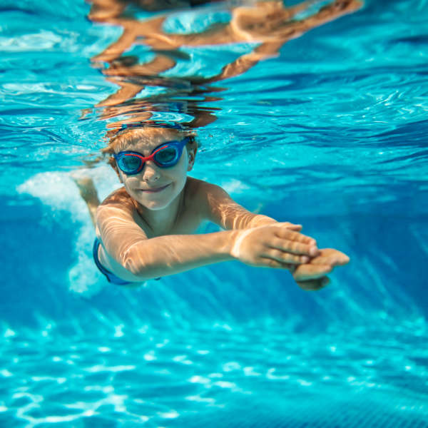 Kid swimming at The Abbey at Spring Town Center in Spring, Texas