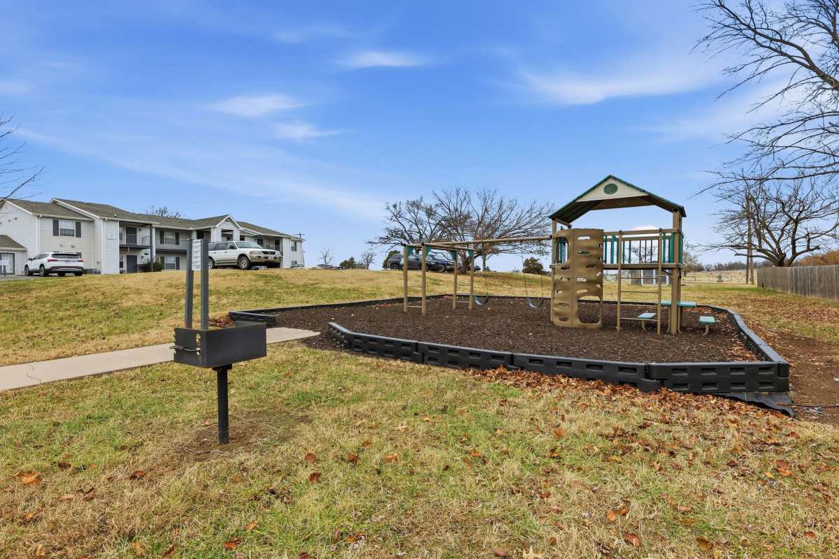 A playground with slides at Parkford Apartments in Iola, Kansas