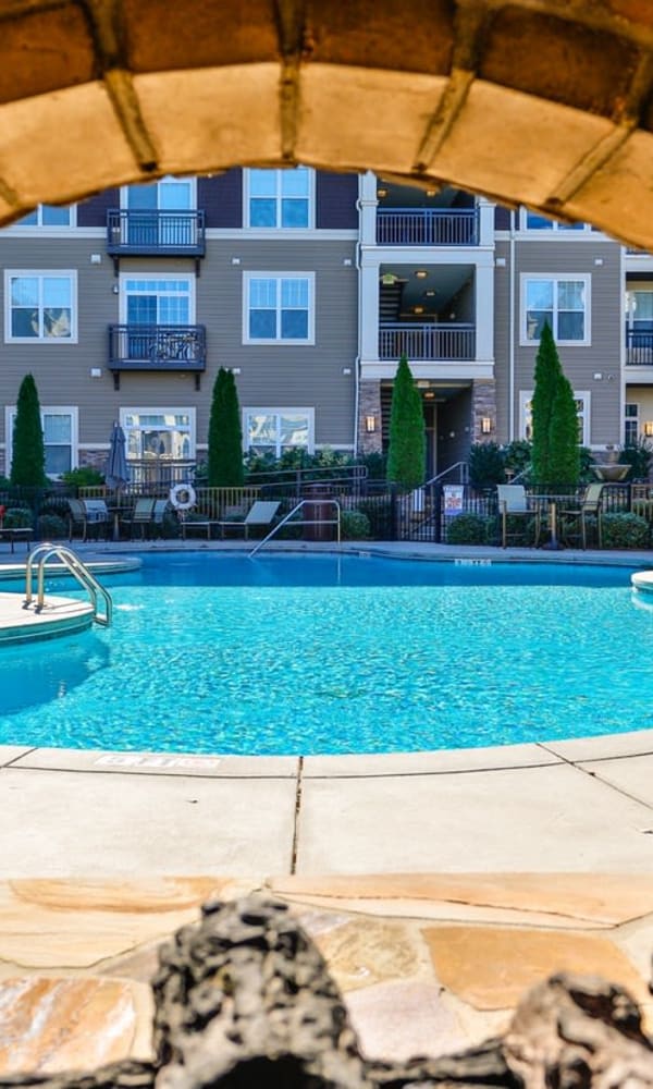 Gorgeous swimming pool and lounge area at Fountains at Mooresville Town Square in Mooresville, North Carolina