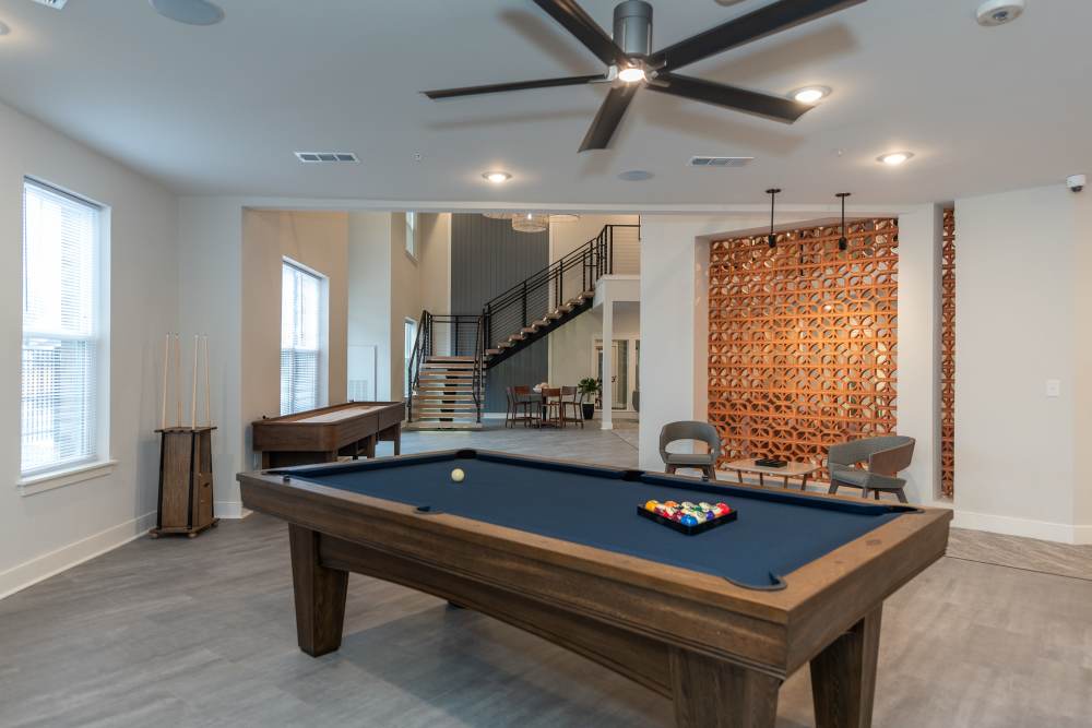 Apartment lounge area with billiards table at Attain at Chic’s Beach, Virginia Beach, Virginia