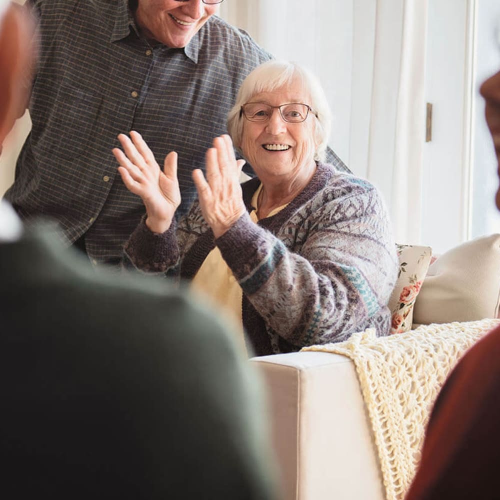 Happy resident clapping at Anthology of Meridian Hills in Indianapolis, Indiana