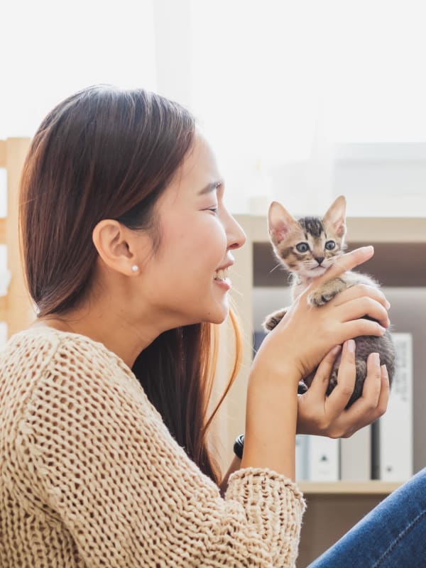 Woman holding her cat at Bellrock Bishop Arts in Dallas, Texas