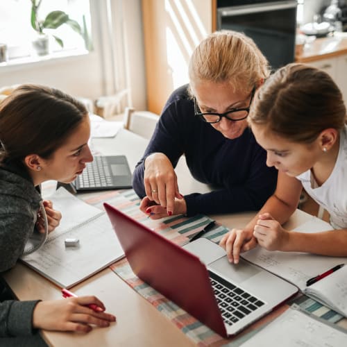 Mother helping daughters with homework at Creekpointe in Midlothian, Virginia