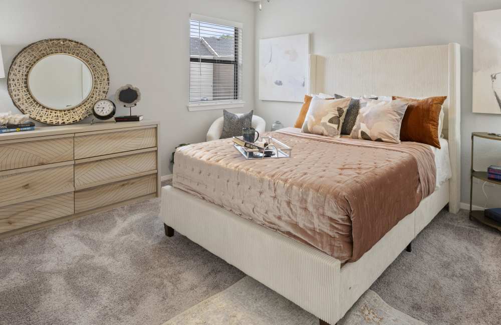 Bedroom with small window and wooden cabinet at Lavera At Lake Highlands in Dallas, Texas, 