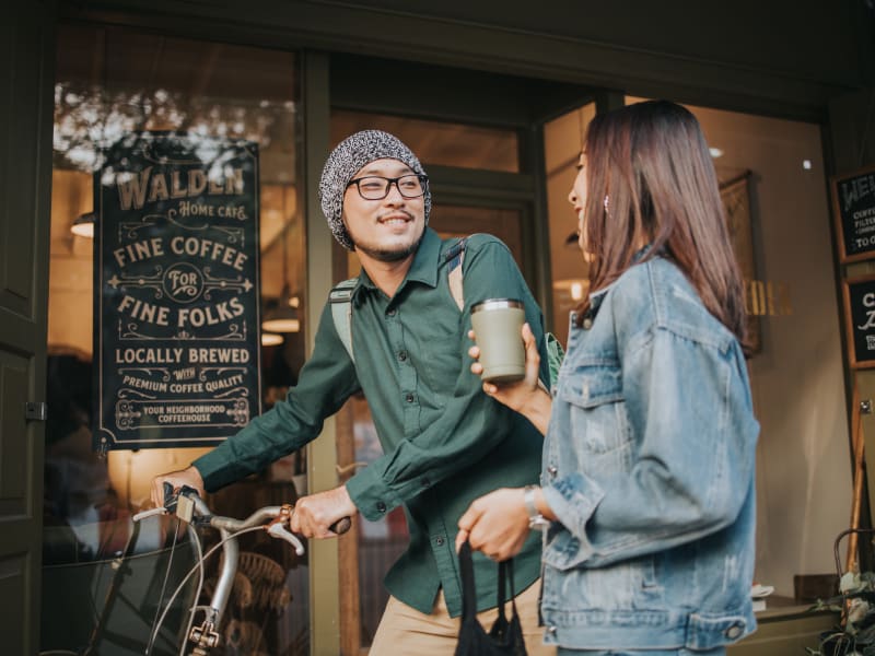 Two residents in front of a coffee shop near Mode at Ballast Point in Tampa, Florida