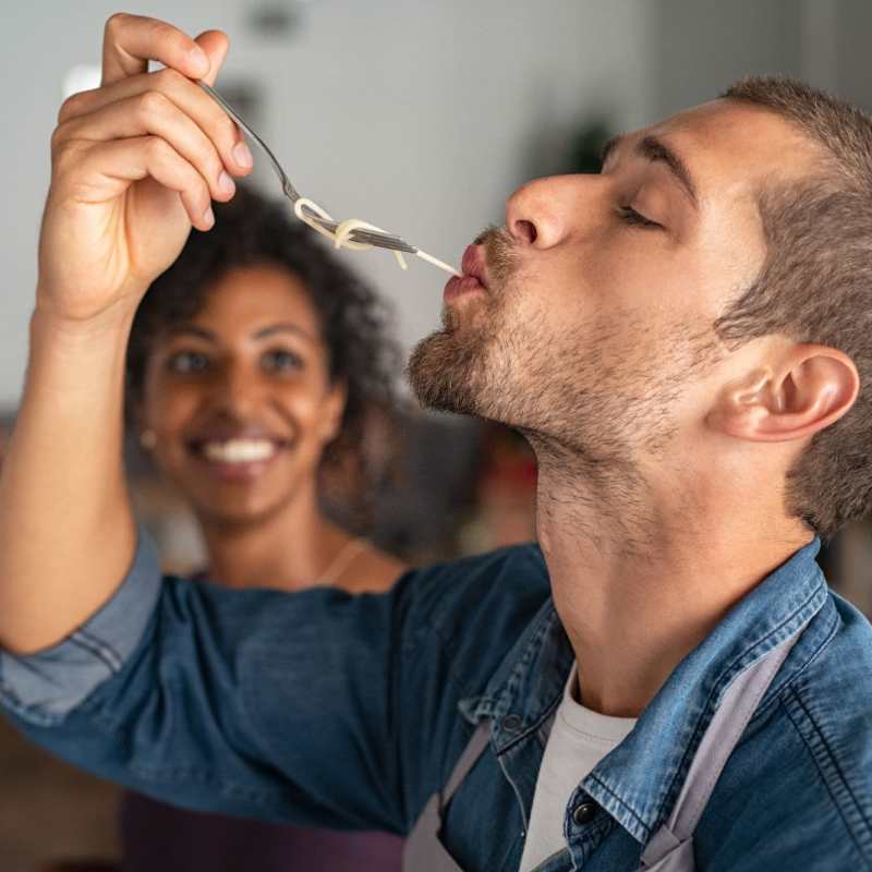 A couple prepare a meal in their kitchen at Magnolia Run, Virginia Beach, Virginia