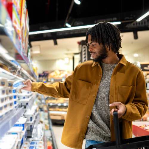 Resident shopping at a grocery store at Valley Park Apartments in West Valley City, Utah