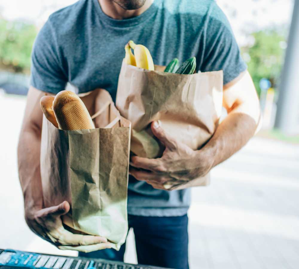 Man loading his car trunk with groceries bought in a shop near The Flats Of Donelson in Nashville, Tennessee