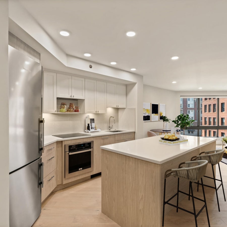 Model kitchen with modern finishes at 28 Exeter at Newbury in Boston, Massachusetts