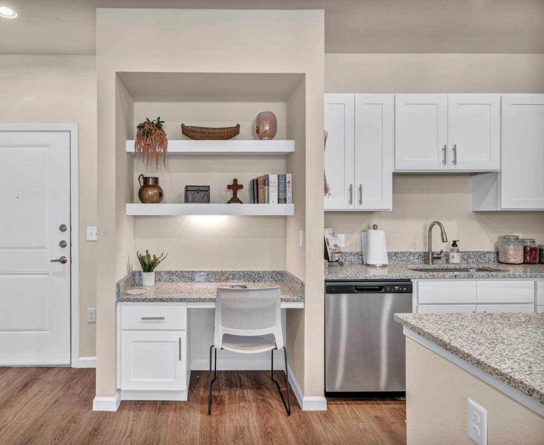 Classically furnished kitchen in a model luxury apartment at Cypress Creek at South Cedar in Temple, Texas