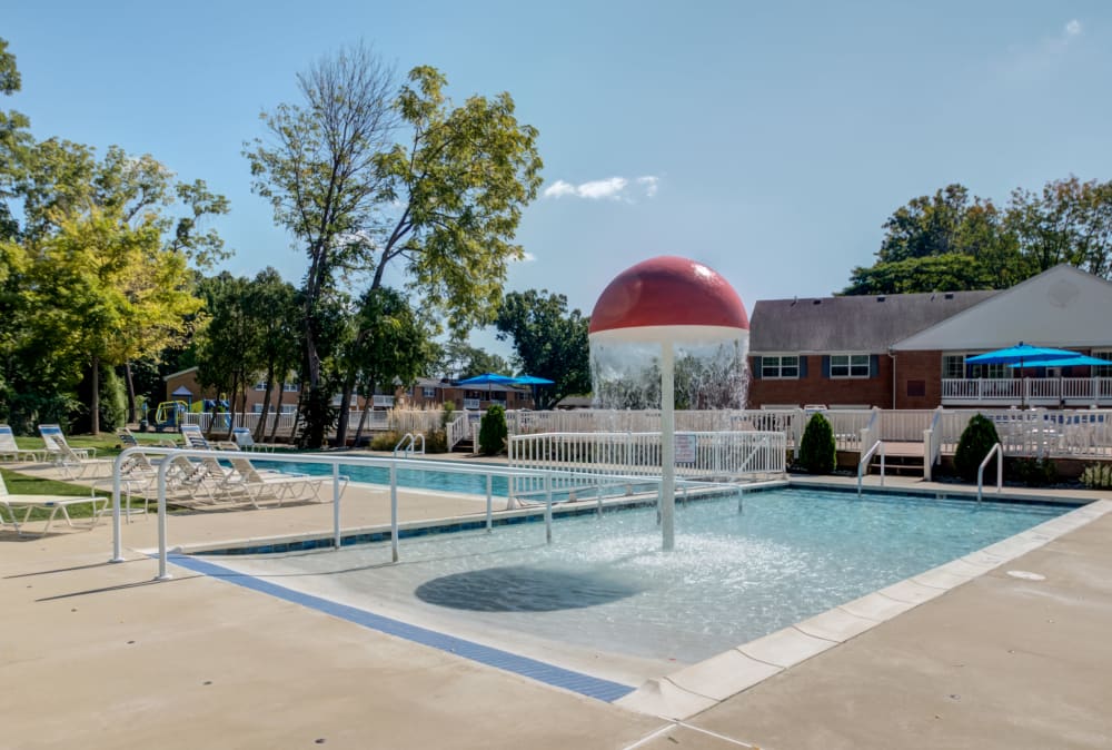 Swimming pool and kids' splash zone at Strafford Station Apartments in Wayne, Pennsylvania