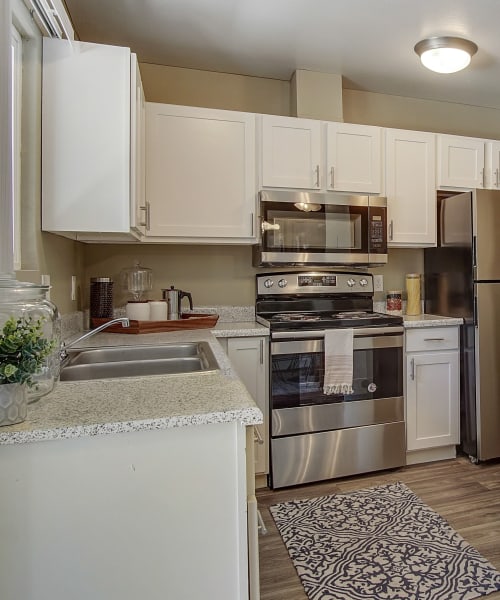 Kitchen with white accents at Marina's Edge Apartment Homes in Sparks, Nevada