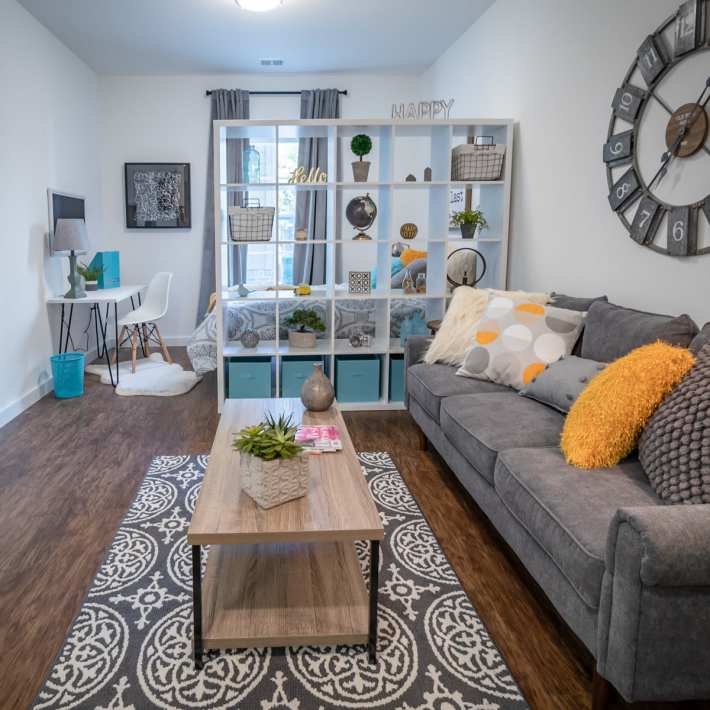 Living room with a couch and coffee table at Attain Shockoe, Richmond, Virginia  
