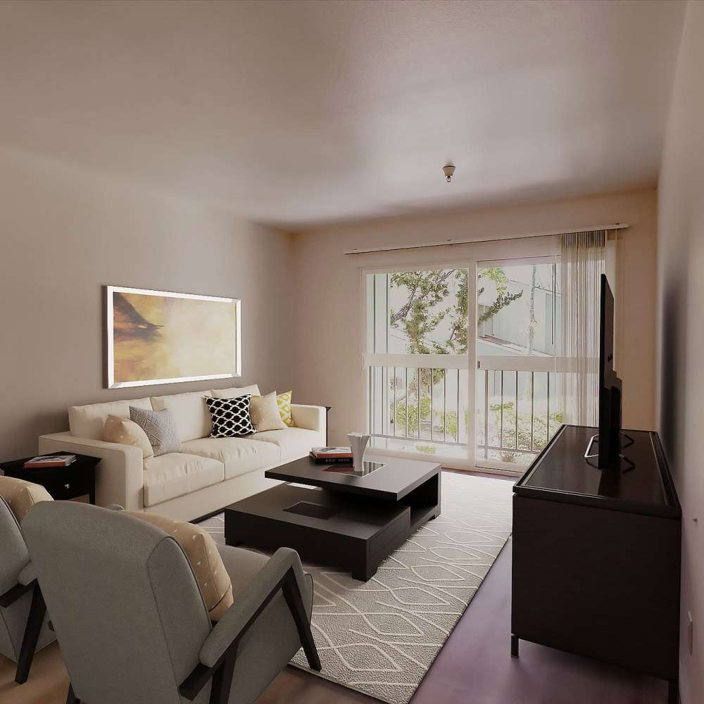 Living room with a comfortable couch at Terman Apartments in Palo Alto, California
