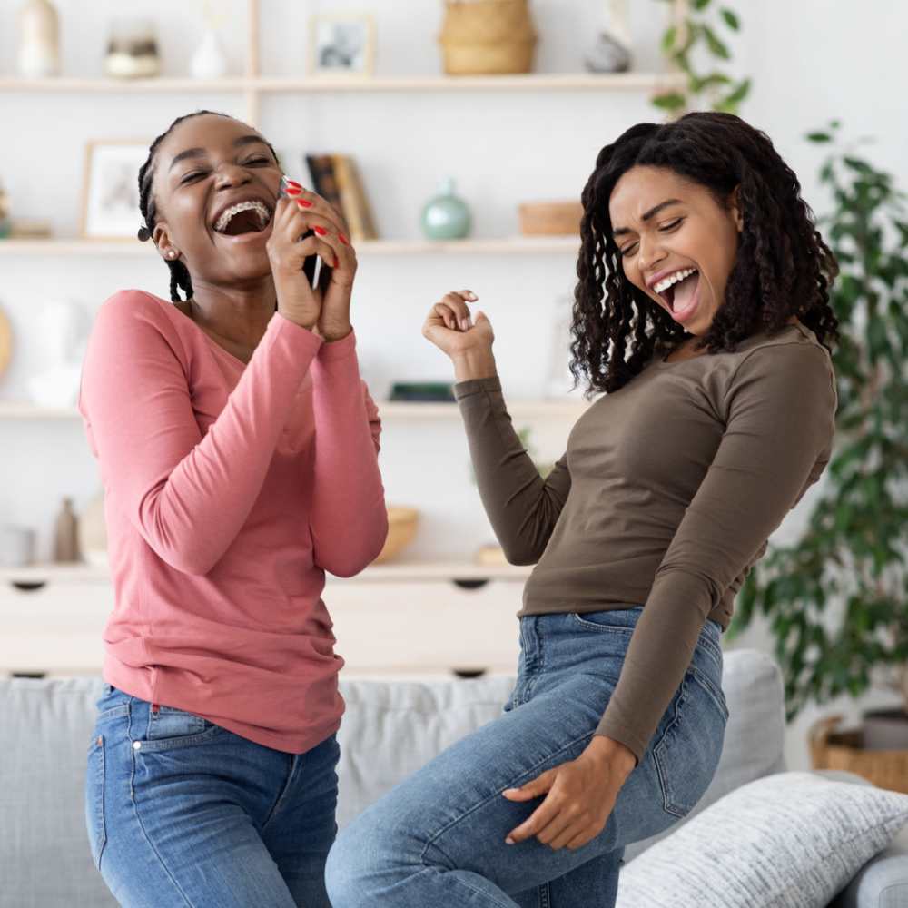 Mother and daughter dancing in their new apartment at Central West End Apartments in Saint Louis, Missouri