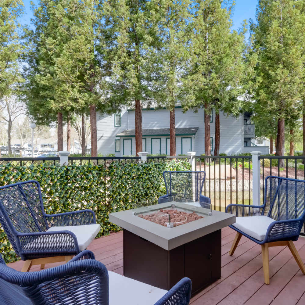 Chairs around a firepit at Country Brook Rental Condominiums in San Ramon, California  