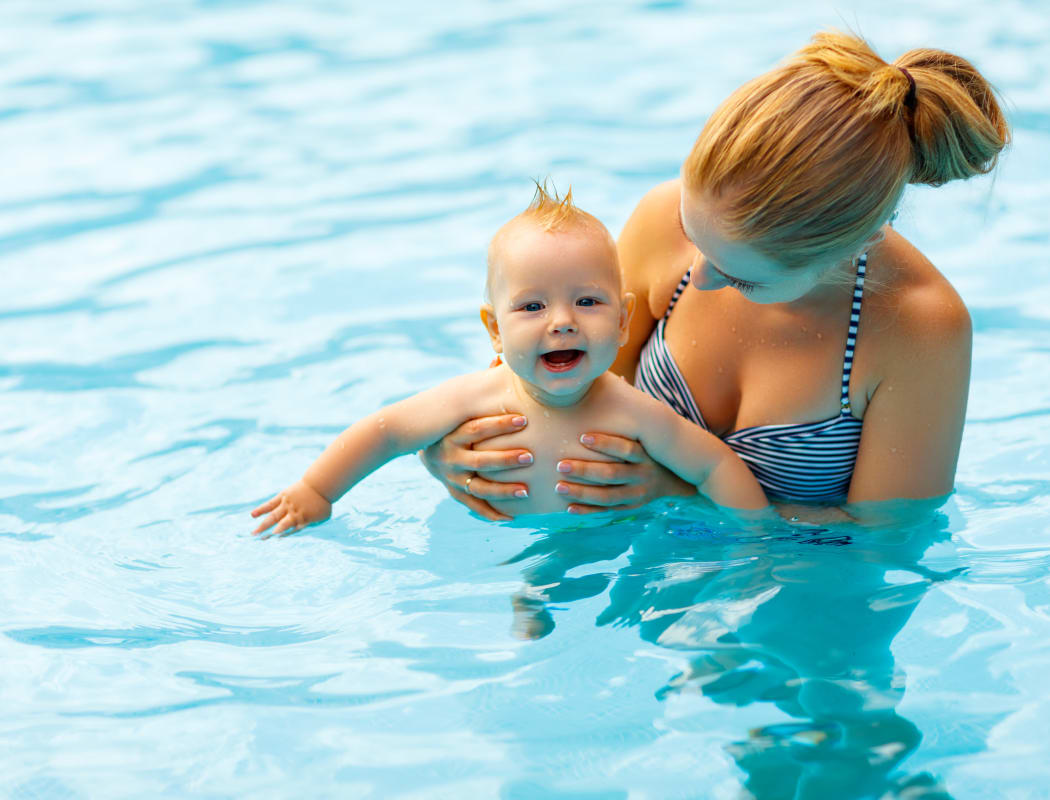 Mother and child swimming at Park at Mission Hills in Broken Arrow, Oklahoma