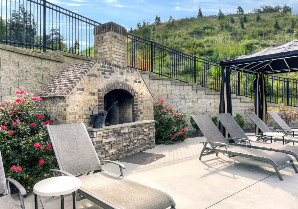 outdoor fire pit located at the pool and lounge chairs at Berrington Village in Asheville, North Carolina