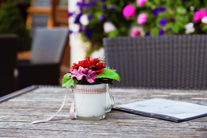 Flowers on a patio at {{location_name}}