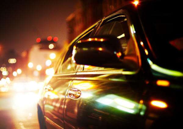 Close up of a car driving through Houston, Texas near Falls of Maplewood Apartments