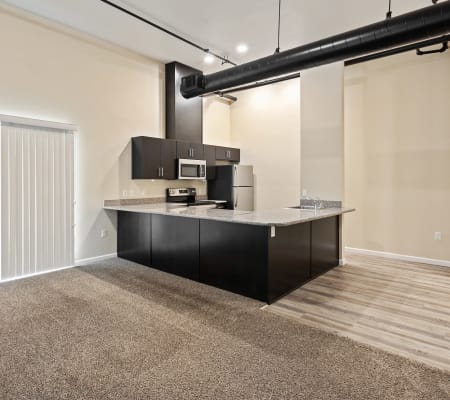Kitchen and living room at Sunrise Residences Apartment Homes in Fairfield, California