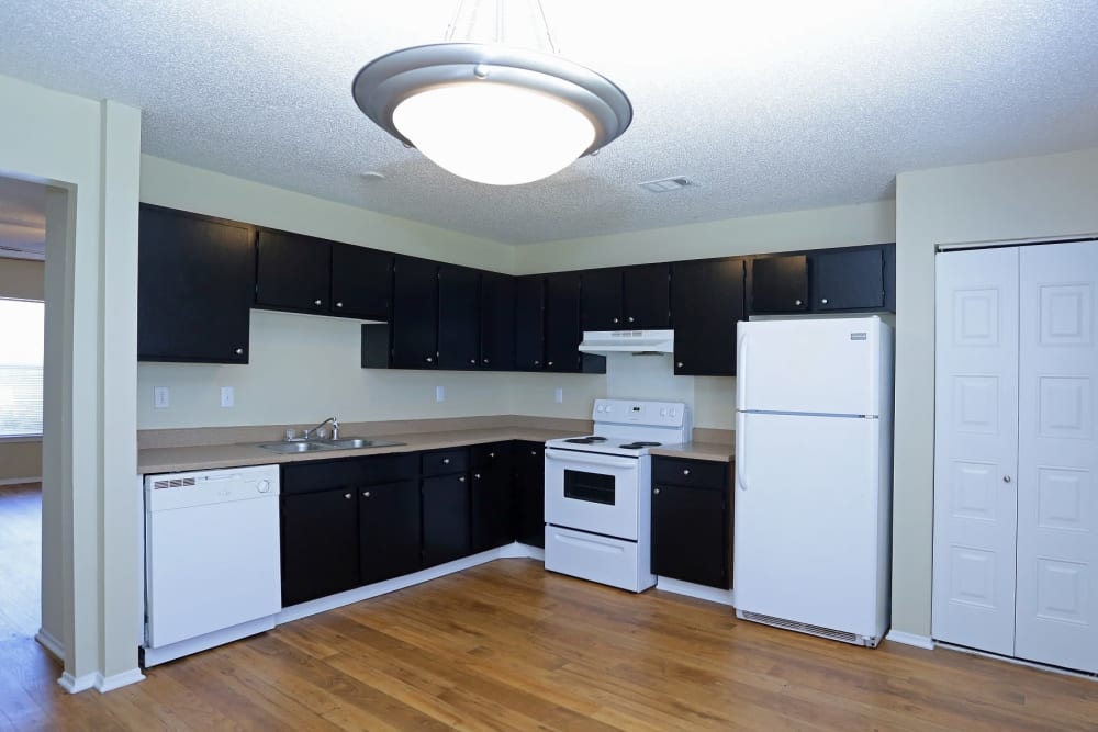 Large Kitchen in a 3 Bedroom townhome, some units have white and others black (shown) appliances at Madison Pines Apartment Homes in Madison AL