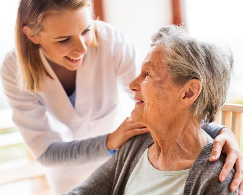 A staff member talking to a resident at Methodist Homes of Alabama & Northwest Florida. 