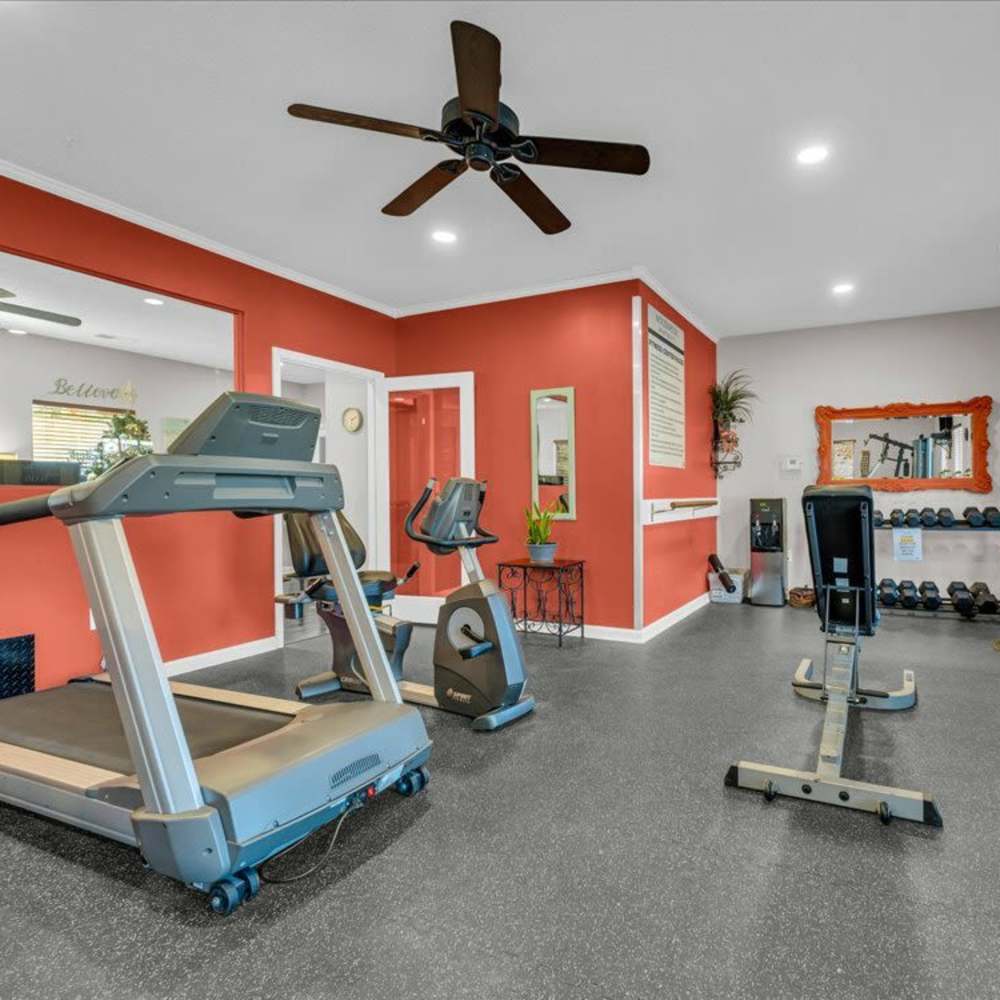 Fitness center with modern exercise equipment at Woodbrook in Gardendale, 