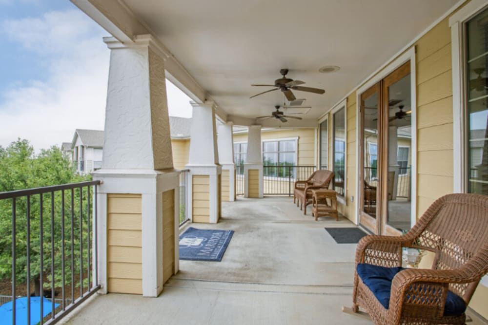 Outdoor seating around a paved walkway at Mariposa at Ella Boulevard in Houston, Texas