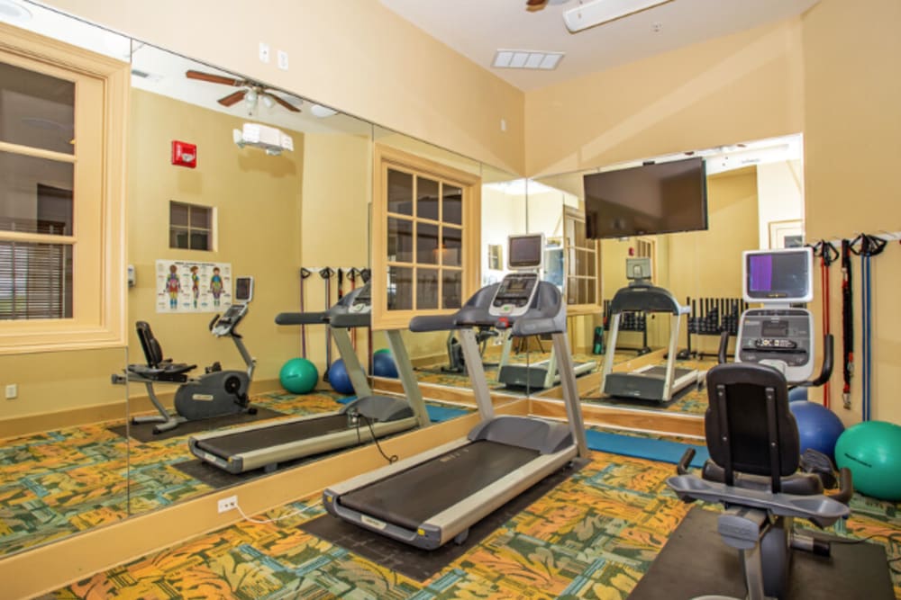 Exercise equipment in the fitness center at Mariposa at Ella Boulevard in Houston, Texas