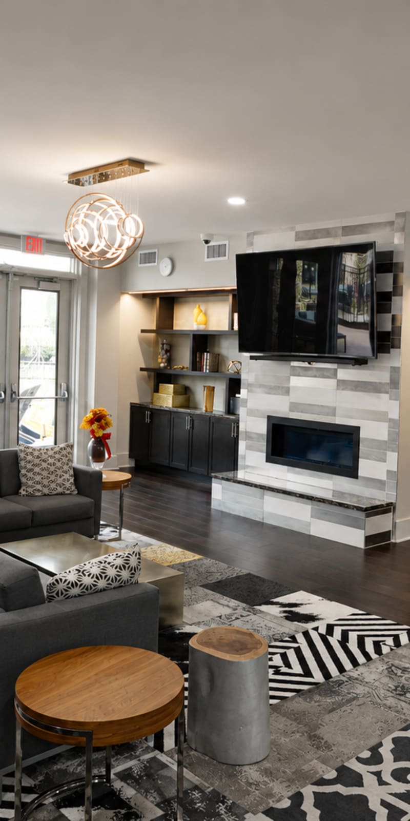 Student lounge with seating, fireplace, and study space at The Den in Columbia, Missouri
