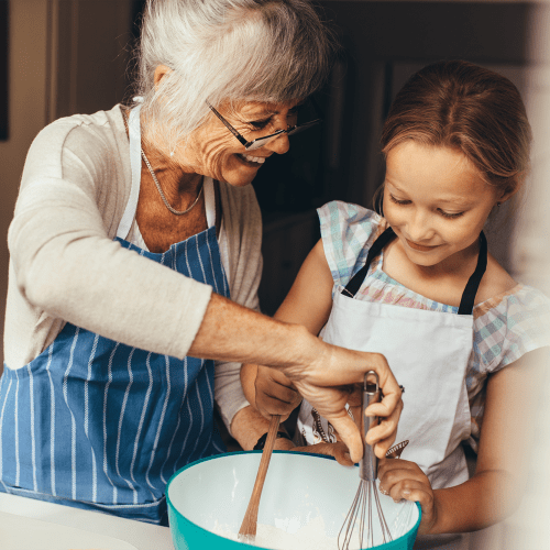 Baking with her grandchild at Mathison Retirement Community in Panama City, Florida. 