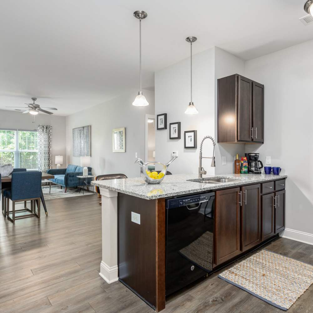 Bar seating at a kitchen island in an apartment at Retreat at the Park in Burlington, North Carolina