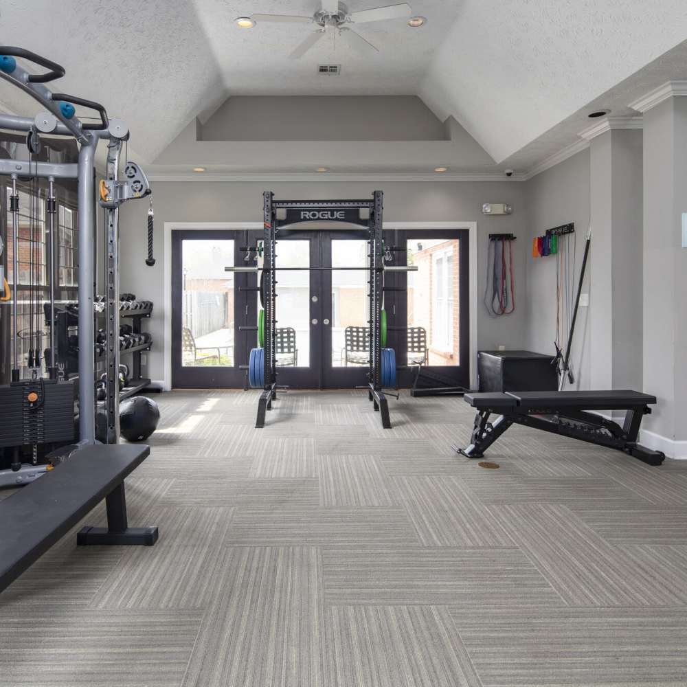 Well-equipped fitness center with treadmills and weight-lifting machines at Tapestry on Vaughn in Montgomery, Alabama