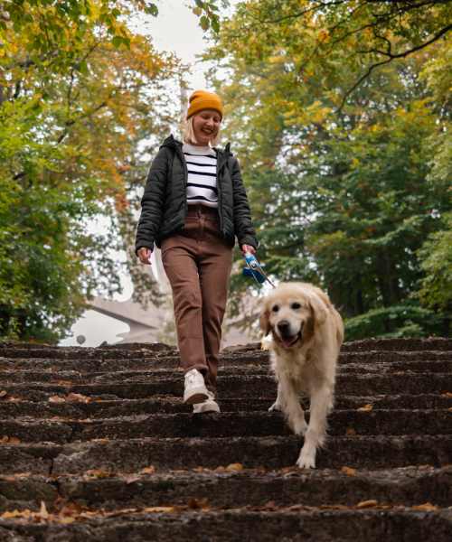 Woman outside with her pet dog near Quail Run in Middleton, Wisconsin