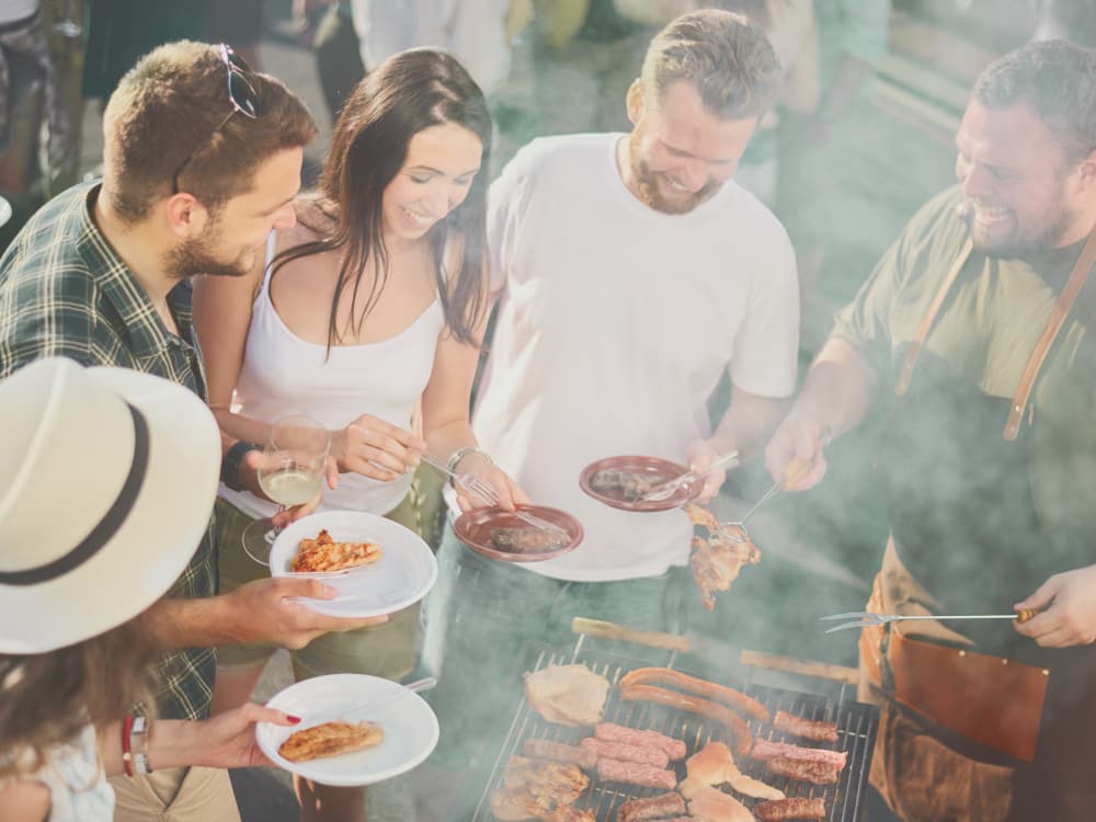 Residents enjoying fresh barbecue near Villa Vita Apartments in Peoria, Arizona