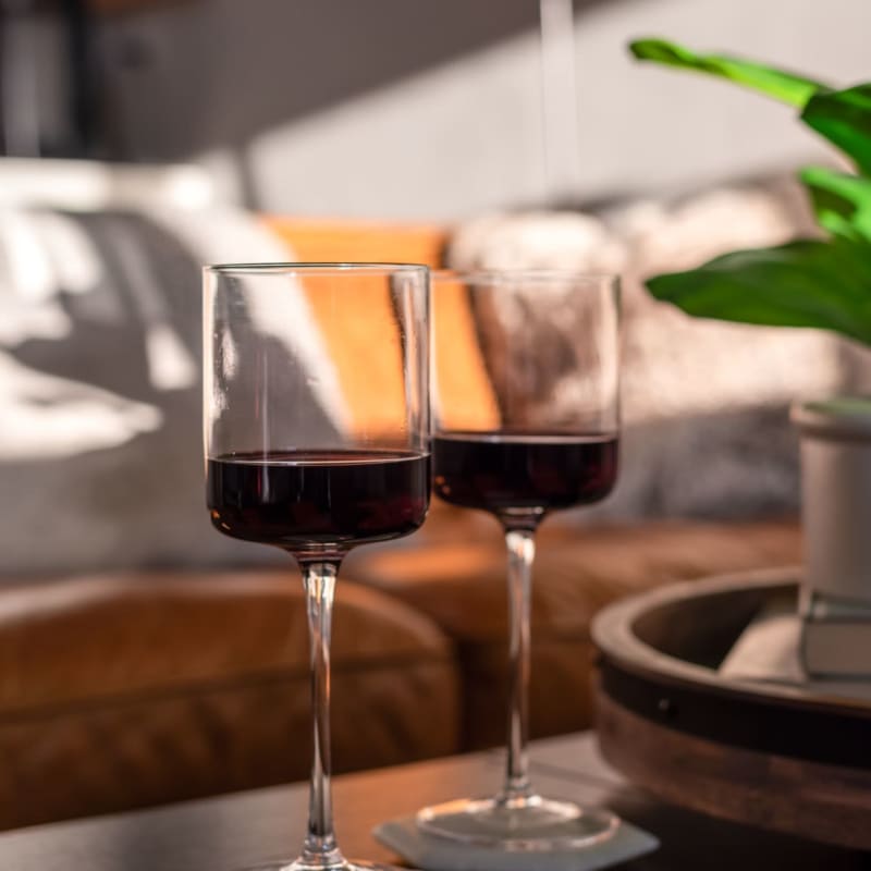 Two wine glasses in a living space at The Residences at Renaissance in Charlotte, North Carolina