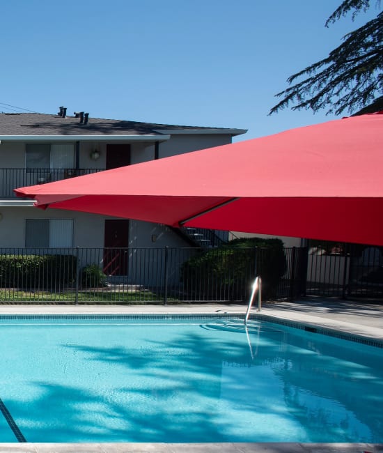 Swimming pool area at Coralaire Apartments in Sacramento, California