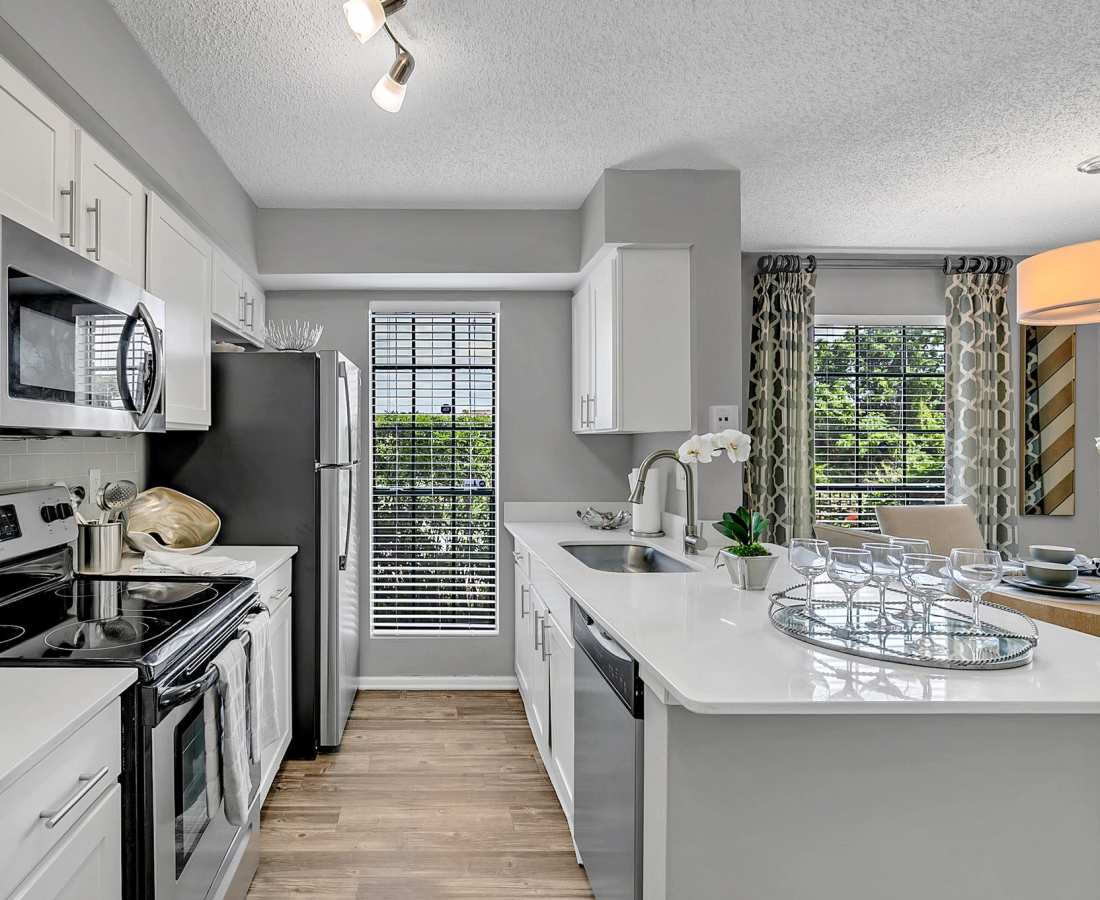 Kitchen with white countertops at Rosemont Windermere in Orlando, Florida