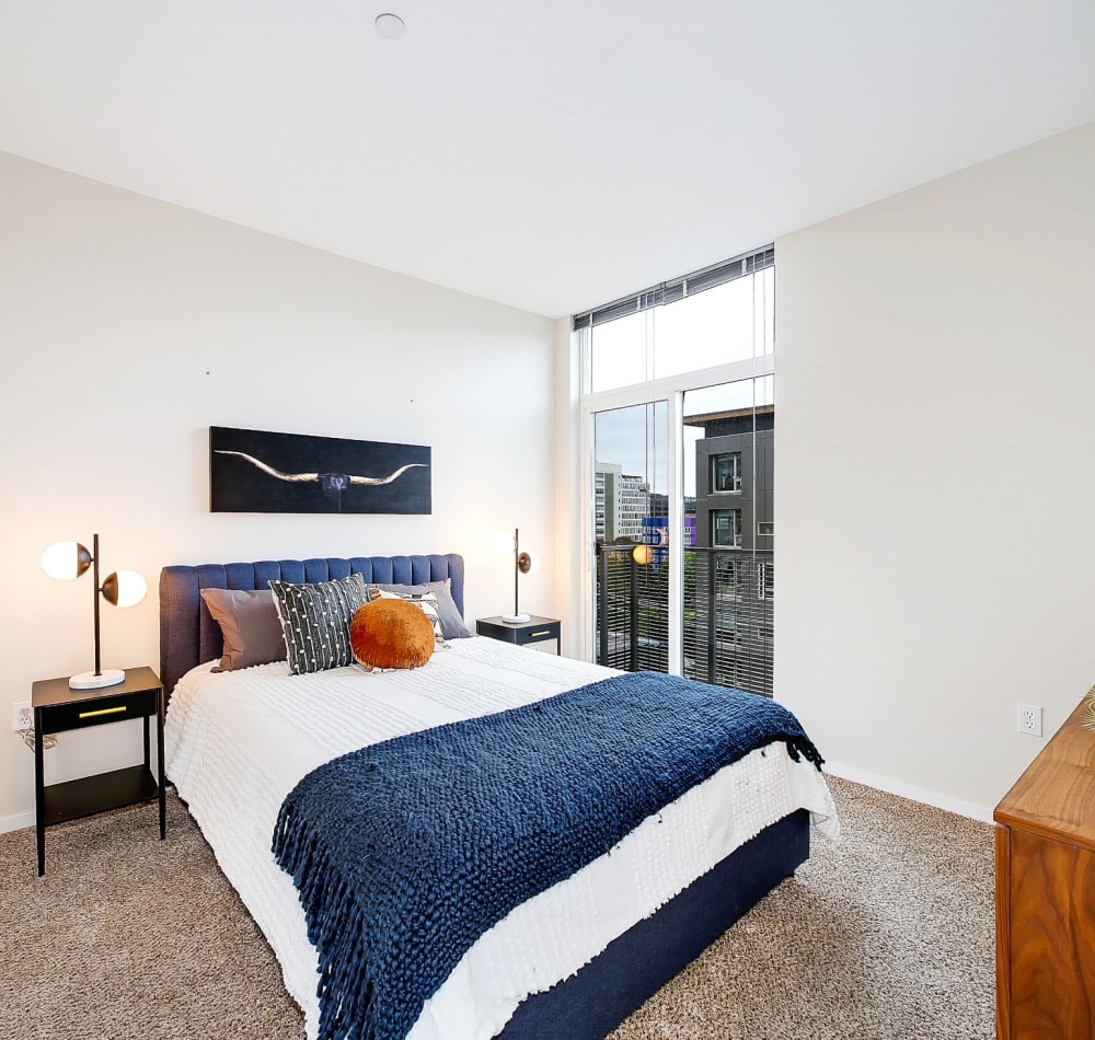 Spacious and well lit bedroom in a model home at Alley South Lake Union in Seattle, Washington