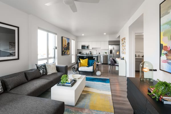 Spacious living room and upgraded kitchen space at Hudson on Farmer in Tempe, Arizona