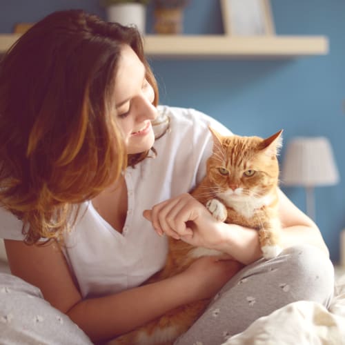 A resident holding her cat at Sampson Road in Dahlgren, Virginia