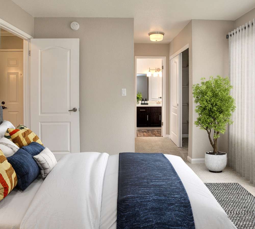 Bedroom with ensuite bathroom at Seventeen Mile Drive Village Apartment Homes in Pacific Grove, California