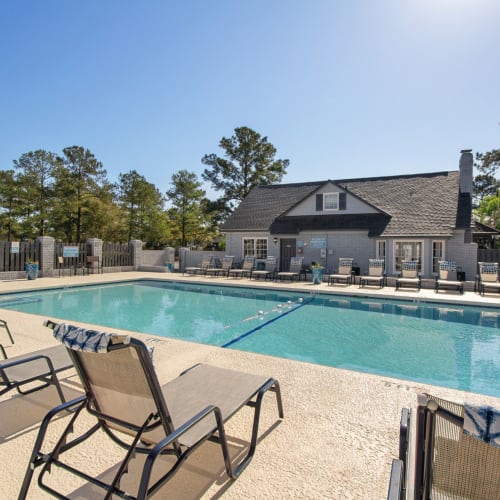 Lounge chairs by the pool at Vesta Creeks Run in North Charleston, South Carolina