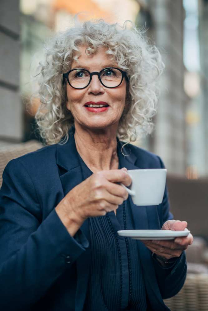 Resident having coffee near Heirloom at Torrey Pines in Las Vegas, Nevada