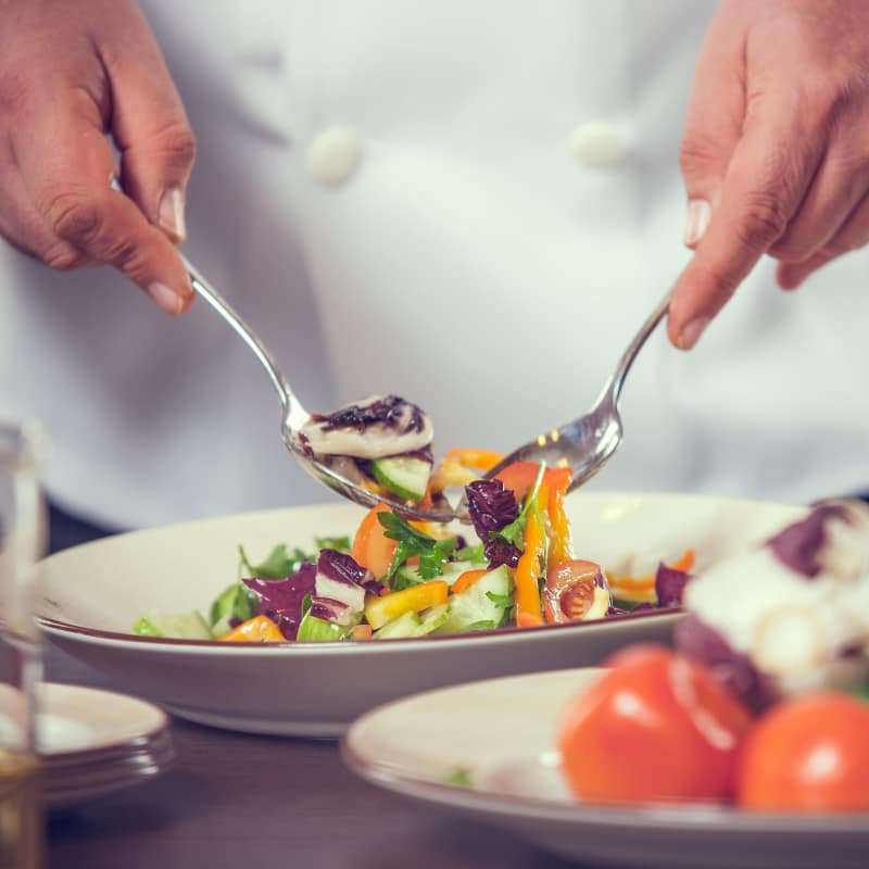 Chef topping plate at The Commons at Elk Grove in Elk Grove, California